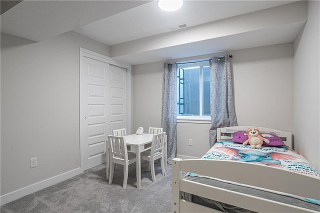 bedroom featuring light carpet