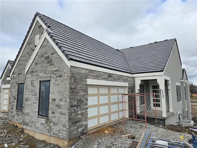 view of property exterior featuring a garage