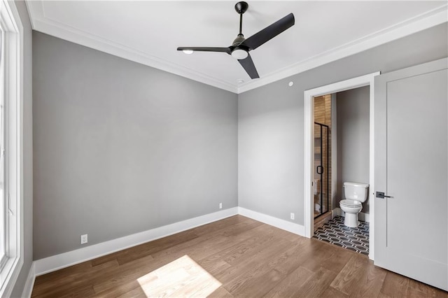 13709 Pembroke Ln, Leawood, KS 66224 - unfurnished bedroom featuring wood finished floors, crown molding, baseboards, and ensuite bathroom