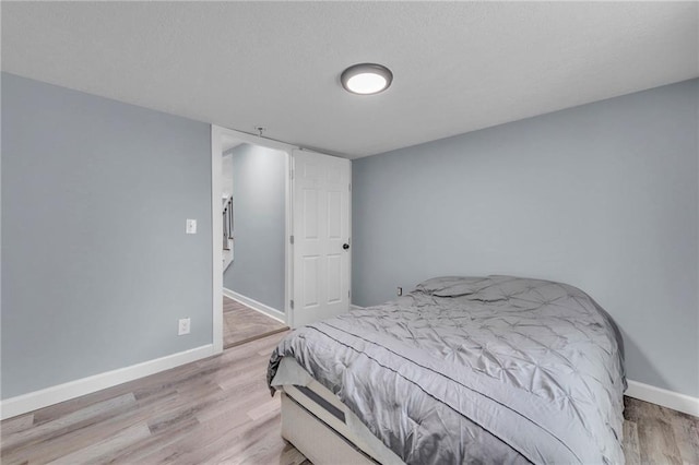 bedroom with light wood-type flooring