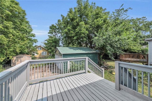 wooden terrace with a shed