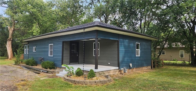 bungalow-style house featuring a front yard