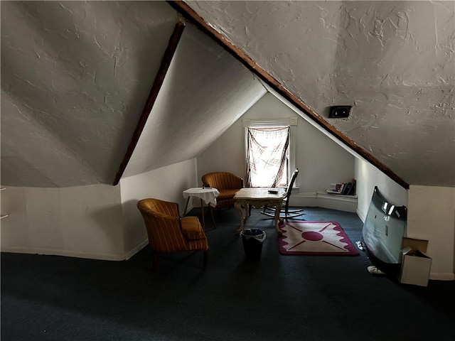 bonus room with carpet flooring and vaulted ceiling