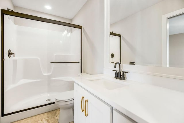 bathroom featuring a stall shower, recessed lighting, toilet, and vanity