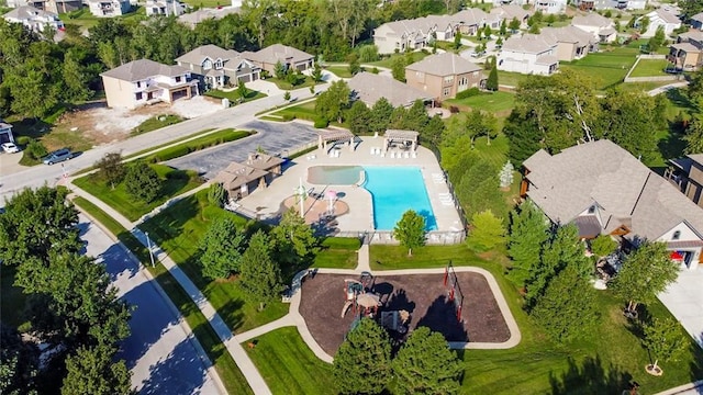 birds eye view of property with a residential view