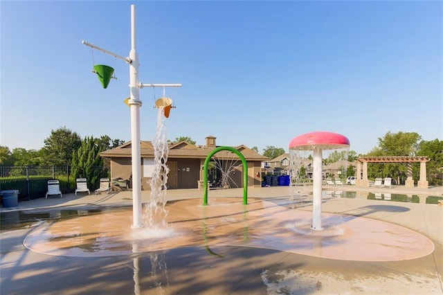 surrounding community with a pergola, fence, and a patio area