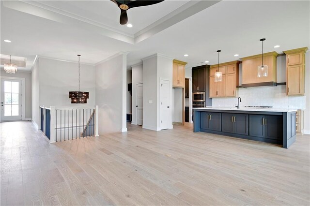 24940 W 98th Pl, Lenexa, KS 66227 - kitchen featuring stainless steel appliances, ornamental molding, light countertops, recessed lighting, and light wood-type flooring