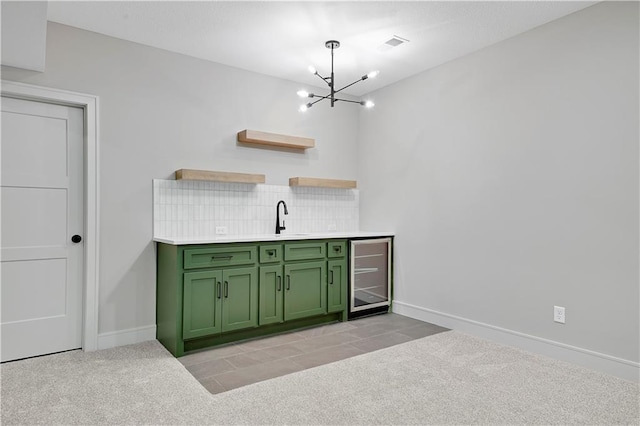 24940 W 98th Pl, Lenexa, KS 66227 - indoor wet bar with wine cooler, a chandelier, decorative backsplash, and light colored carpet