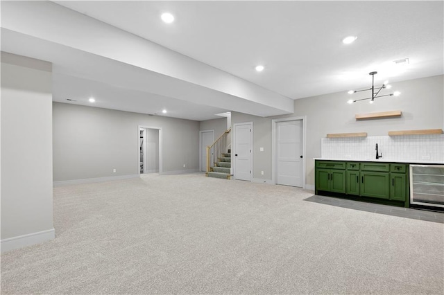 24940 W 98th Pl, Lenexa, KS 66227 - basement featuring beverage cooler, light colored carpet, stairs, and recessed lighting