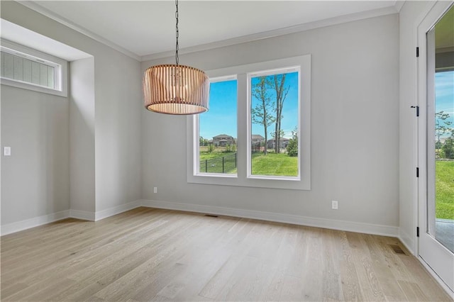 24940 W 98th Pl, Lenexa, KS 66227 - unfurnished dining area with light wood-type flooring and crown molding