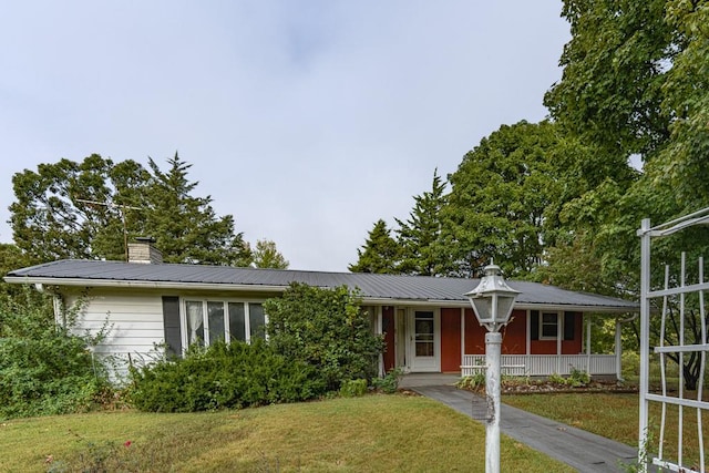 ranch-style house featuring a front yard and a porch