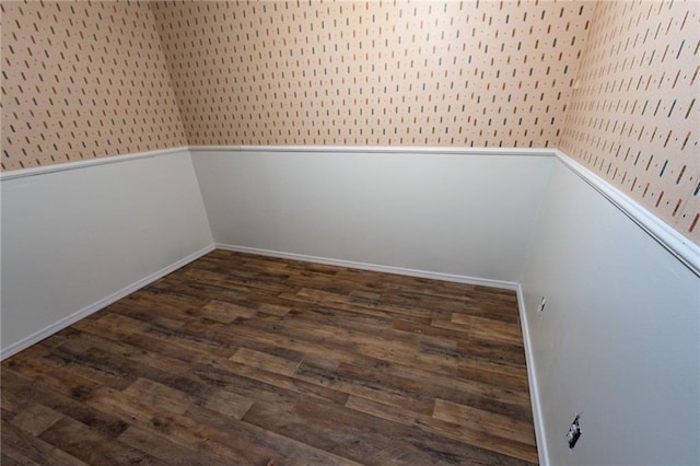 spare room with dark wood-type flooring