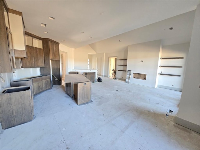 kitchen featuring a center island and vaulted ceiling