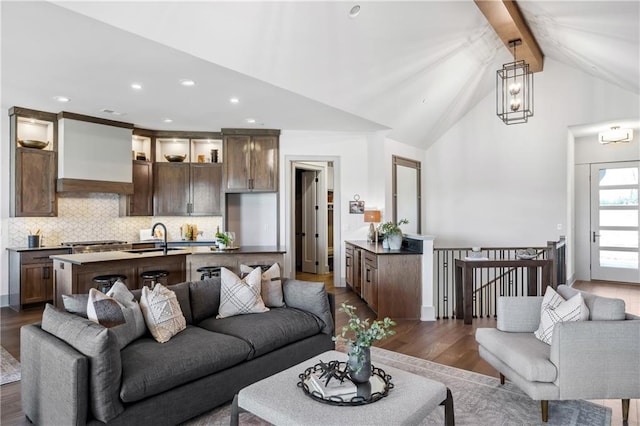 13707 Pembroke Ln, Leawood, KS 66224 - living room featuring beamed ceiling, wood finished floors, high vaulted ceiling, and recessed lighting