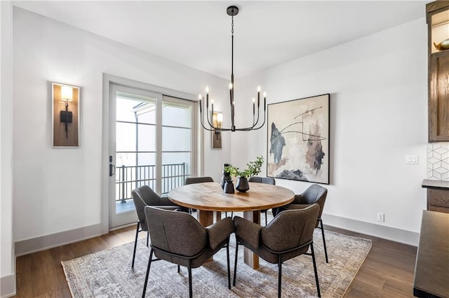 13707 Pembroke Ln, Leawood, KS 66224 - dining area featuring baseboards, an inviting chandelier, wood finished floors, and plenty of natural light