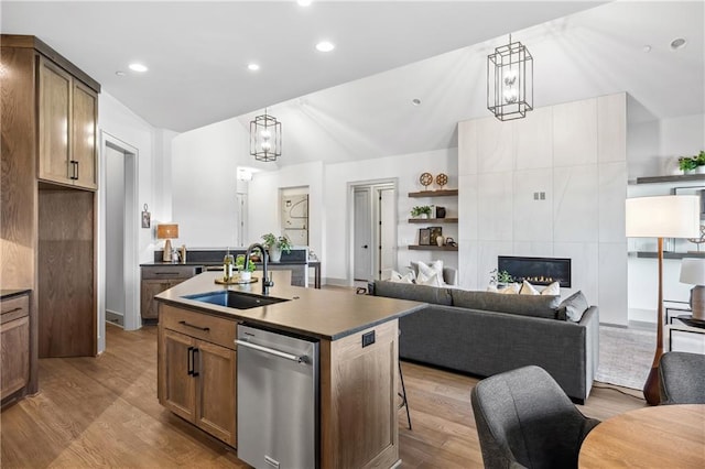 13707 Pembroke Ln, Leawood, KS 66224 - kitchen with a sink, open floor plan, dark countertops, wood finished floors, and dishwasher