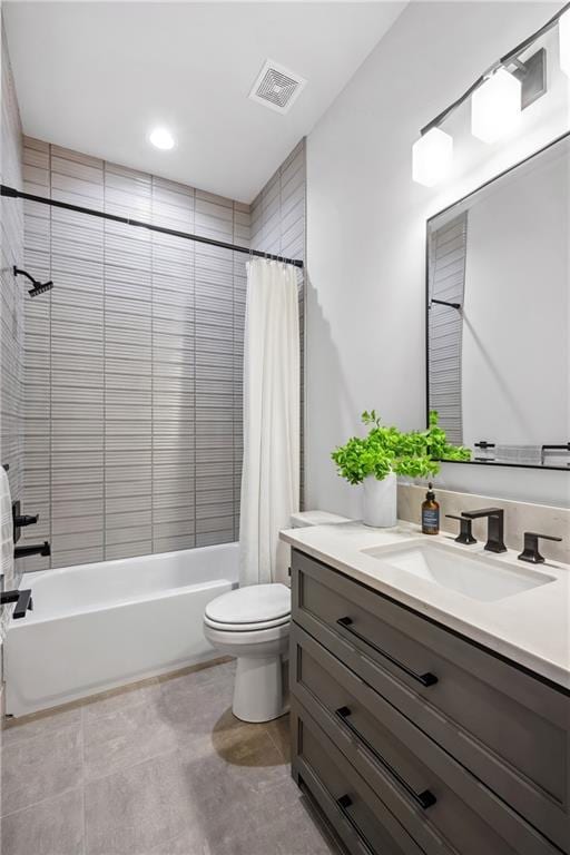 13707 Pembroke Ln, Leawood, KS 66224 - full bathroom featuring tile patterned floors, vanity, toilet, visible vents, and shower / bath combination with curtain
