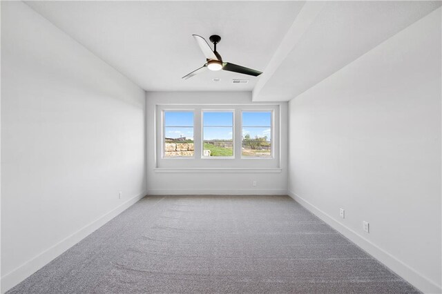 13707 Pembroke Ln, Leawood, KS 66224 - unfurnished room featuring baseboards, visible vents, a ceiling fan, and light colored carpet
