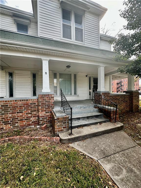 property entrance with covered porch