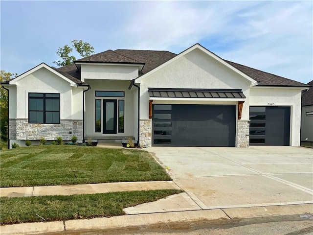 view of front facade featuring a garage and a front lawn