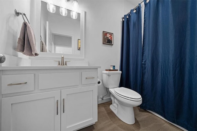 bathroom featuring vanity and toilet