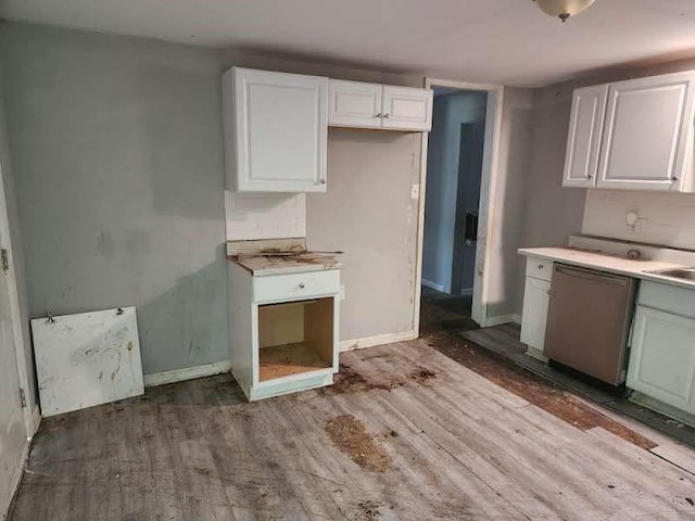 kitchen featuring white cabinets, wood-type flooring, and stainless steel dishwasher