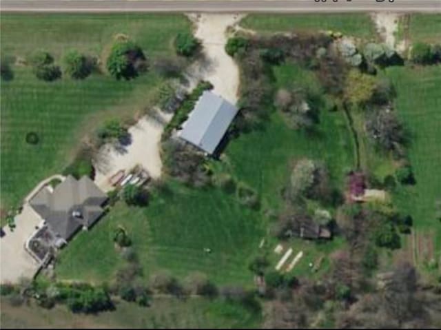 birds eye view of property with a rural view