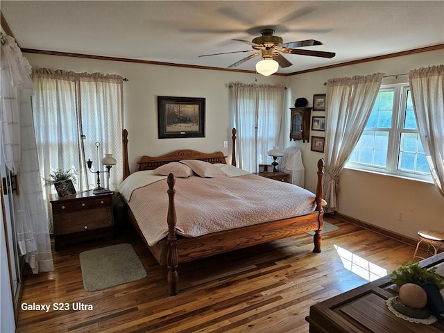 bedroom with ceiling fan, ornamental molding, and light hardwood / wood-style floors