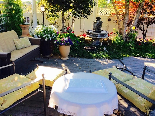 exterior space featuring an outdoor hangout area and a deck