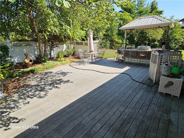24450 171st St, Leavenworth, KS 66048 - wooden deck featuring a gazebo, fence, and outdoor dining space