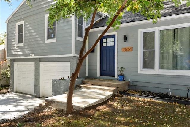 view of exterior entry with a garage