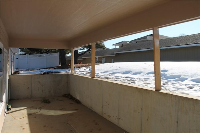 view of snow covered patio
