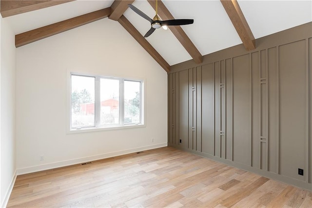 interior space featuring beamed ceiling, ceiling fan, high vaulted ceiling, and light hardwood / wood-style floors