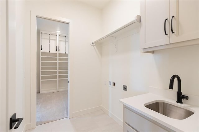 laundry room featuring sink, cabinets, washer hookup, light colored carpet, and hookup for an electric dryer