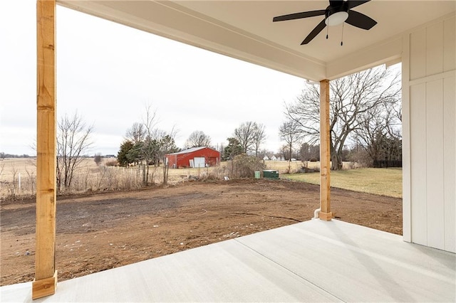 view of yard with a patio and ceiling fan