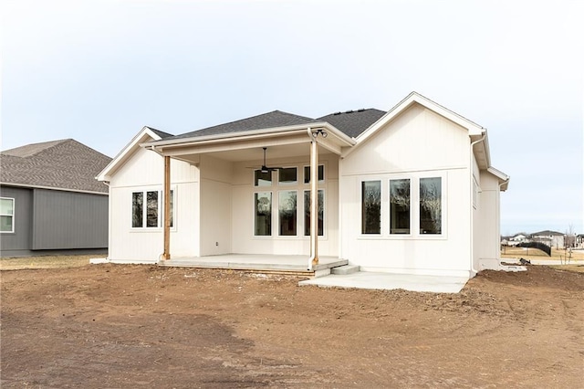 rear view of property featuring ceiling fan and a patio