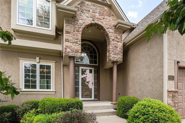 entrance to property featuring a garage