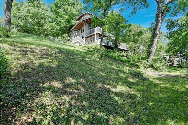 view of yard featuring a wooden deck