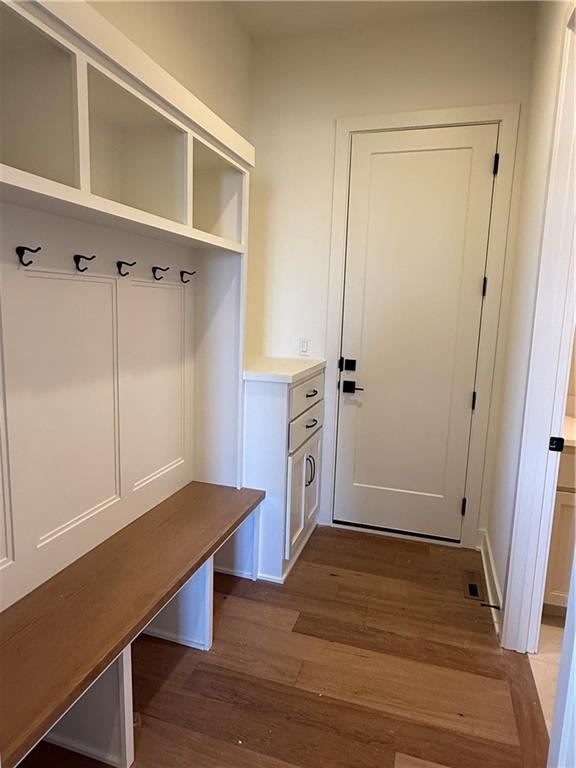 mudroom with light wood-style floors