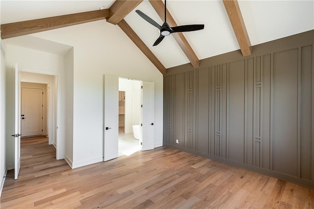unfurnished bedroom with light wood-type flooring, ceiling fan, high vaulted ceiling, and beamed ceiling