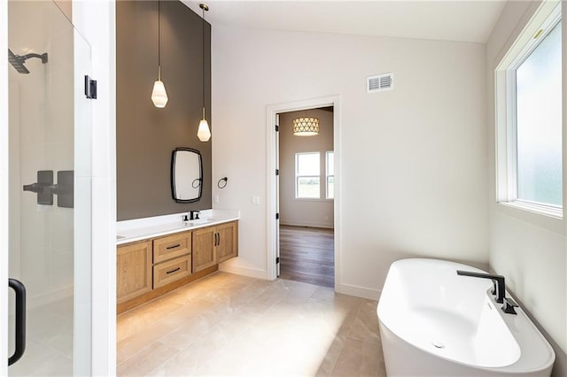 bathroom featuring double vanity, lofted ceiling, visible vents, a sink, and a shower stall