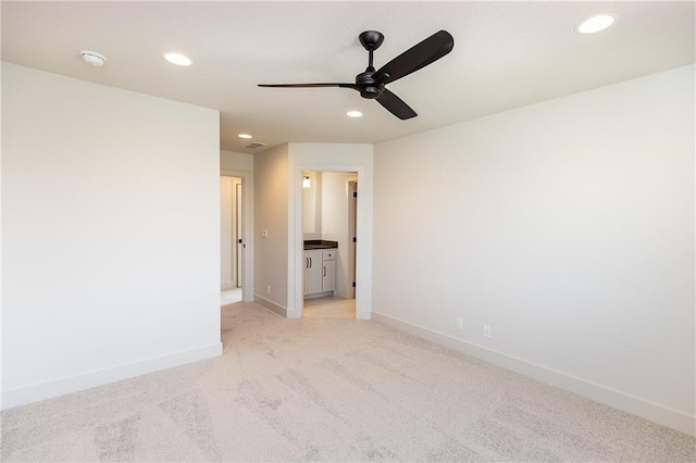 unfurnished room with recessed lighting, light carpet, ceiling fan, and baseboards