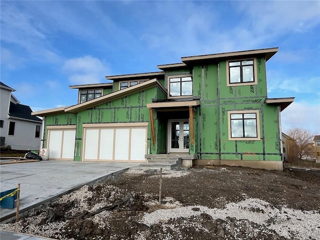 unfinished property featuring a garage