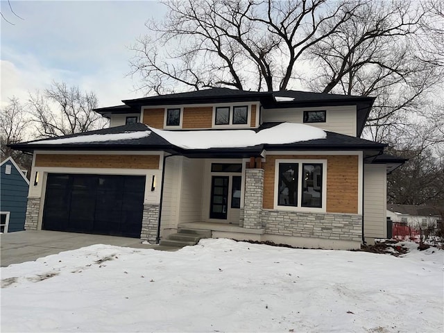 prairie-style house featuring a garage