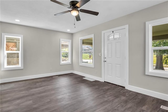 foyer with ceiling fan and dark hardwood / wood-style flooring