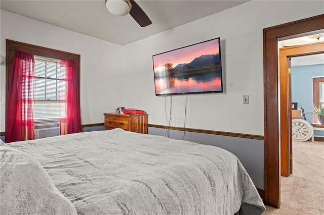 carpeted bedroom featuring cooling unit and ceiling fan