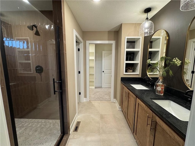 16700 NW 124th St, Platte City, MO 64079 - bathroom with vanity, a textured ceiling, a shower with shower door, and tile patterned flooring