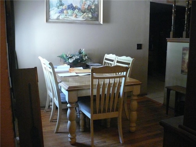 dining area with wood-type flooring