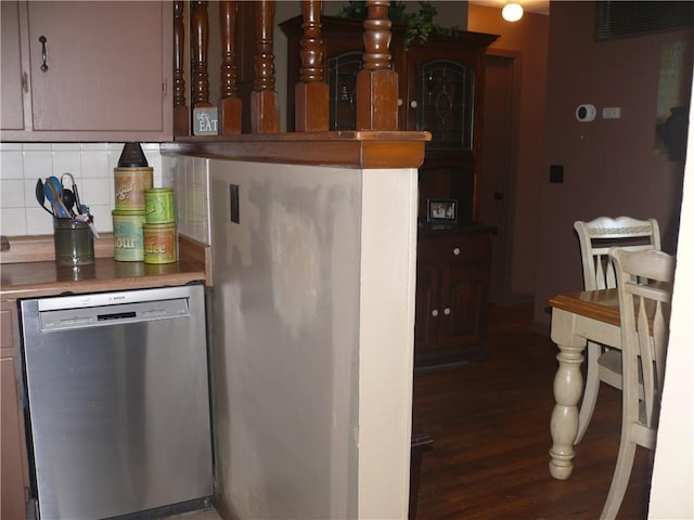 kitchen with backsplash, dishwasher, and wood-type flooring