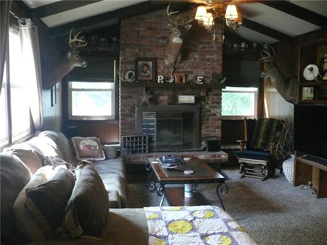 living room with carpet, plenty of natural light, a brick fireplace, and lofted ceiling with beams